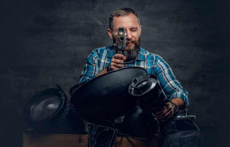 A man videographer in a studio.